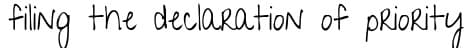 English script sample on lined notebook paper background